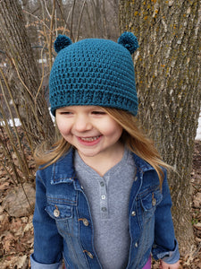 Teal mini pom pom hat by Two Seaside Babes