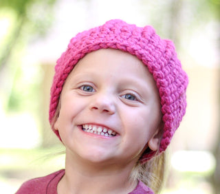 Raspberry pink messy bun ponytail beanie winter hat
