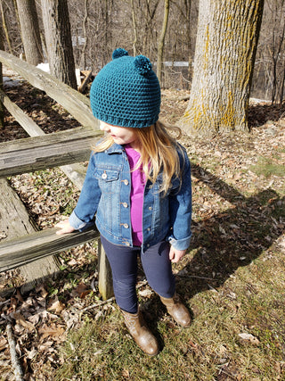 Teal mini pom pom hat