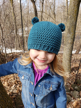 Teal mini pom pom hat