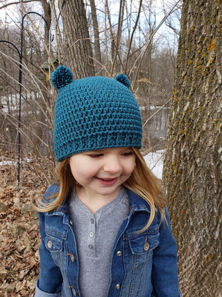 Teal mini pom pom hat