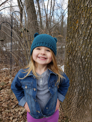 Teal mini pom pom hat