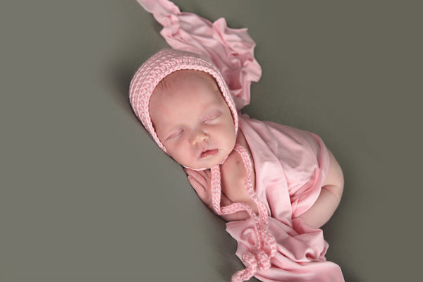 Pale pink newborn baby bonnet