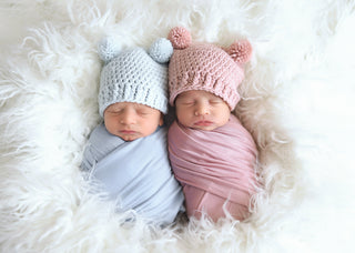 Pale blue mini pom pom hat