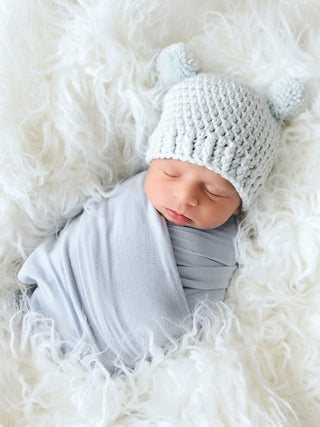 Pale blue mini pom pom hat by Two Seaside Babes