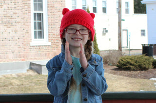 Red mini pom pom hat