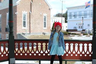 Red mini pom pom hat