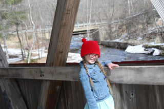 Red mini pom pom hat