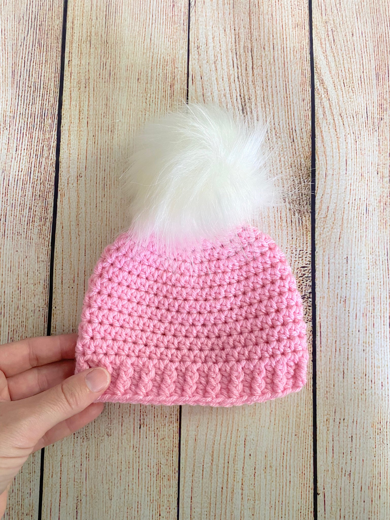 Pink faux fur pom pom hat by Two Seaside Babes