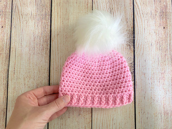 Pink faux fur pom pom hat