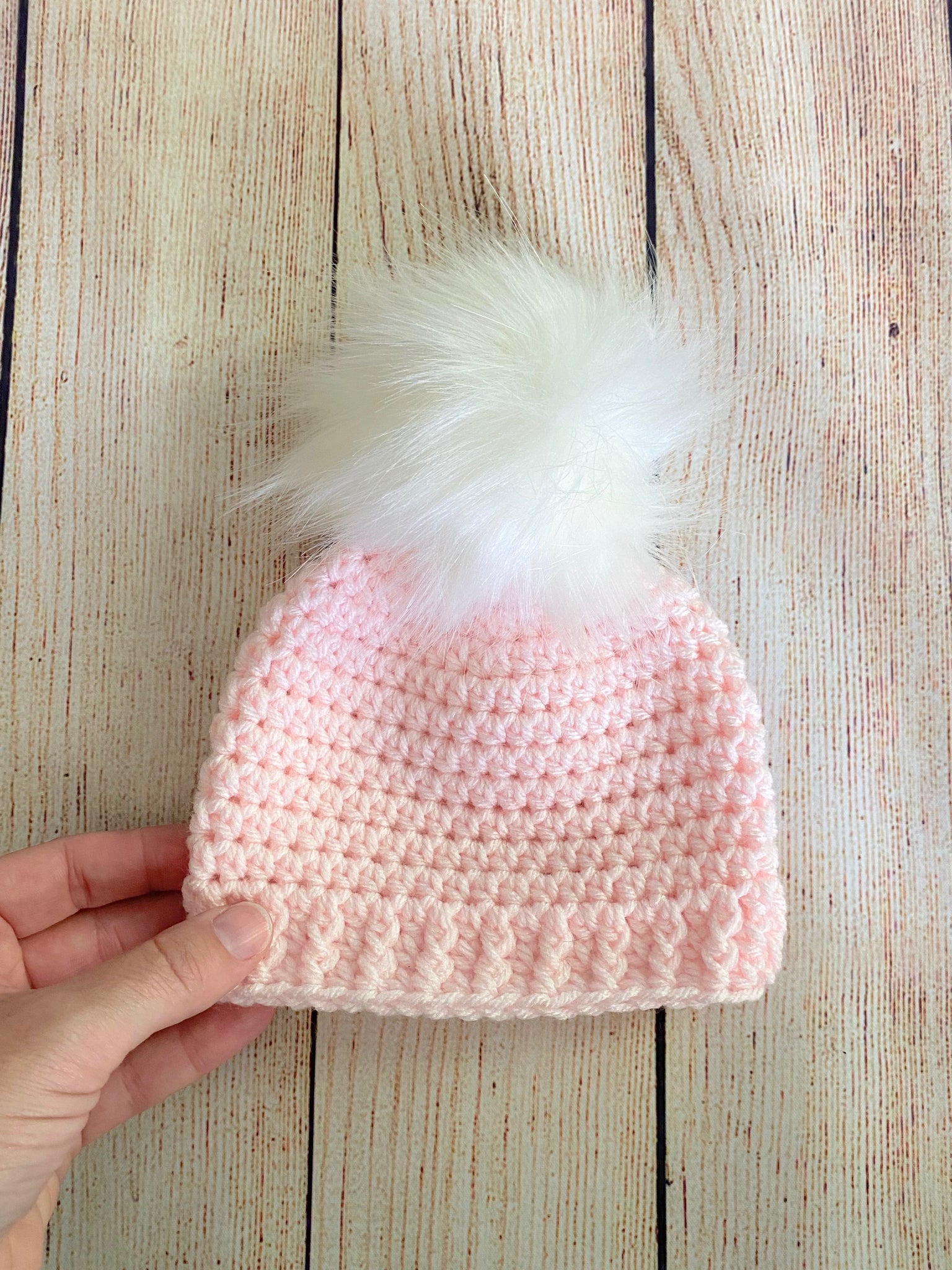 Pale pink faux fur pom pom hat by Two Seaside Babes