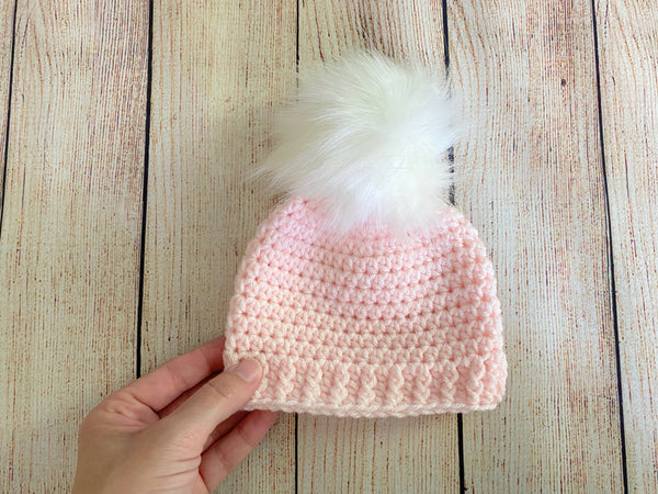 Pale pink faux fur pom pom hat