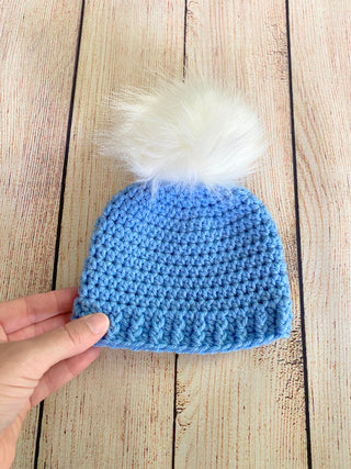 Blue faux fur pom pom hat by Two Seaside Babes