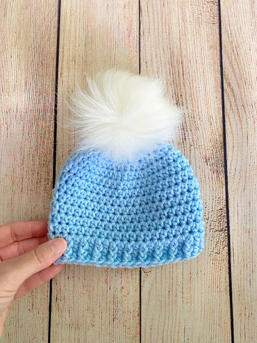 Baby blue faux fur pom pom hat by Two Seaside Babes