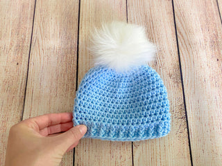 Baby blue faux fur pom pom hat