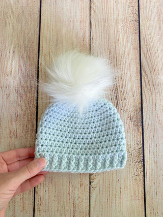 Pale blue faux fur pom pom hat by Two Seaside Babes