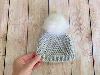 Pale gray faux fur pom pom hat