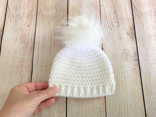 White faux fur pom pom hat