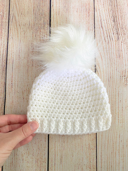 White faux fur pom pom hat by Two Seaside Babes