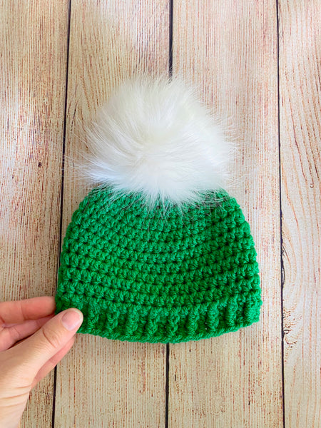 Green faux fur pom pom hat by Two Seaside Babes