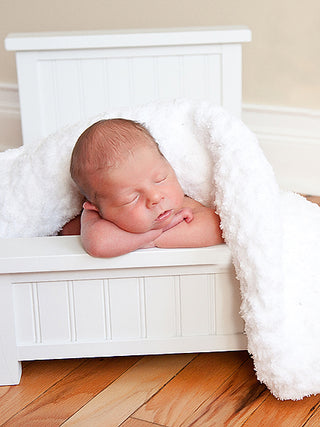 White soft and fluffy crochet baby blanket by Two Seaside Babes