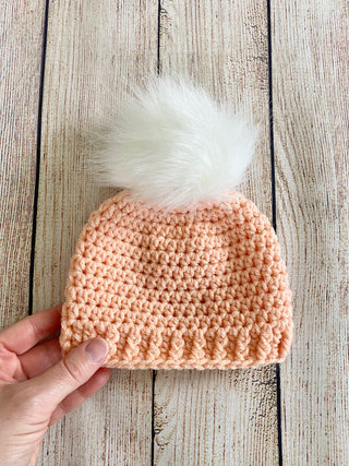 Peach faux fur pom pom hat by Two Seaside Babes