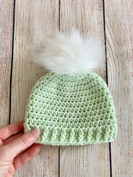 Pale green faux fur pom pom hat by Two Seaside Babes