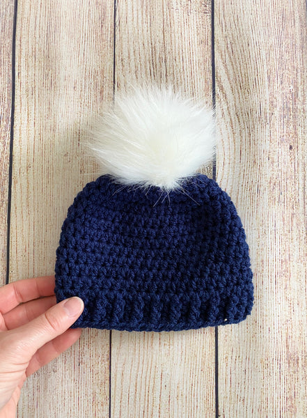 Navy blue faux fur pom pom hat by Two Seaside Babes