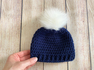 Navy blue faux fur pom pom hat