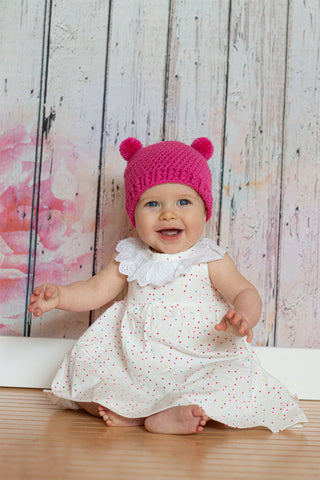 Dark pink mini pom pom hat