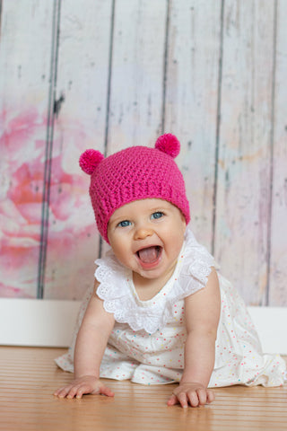 Dark pink mini pom pom hat