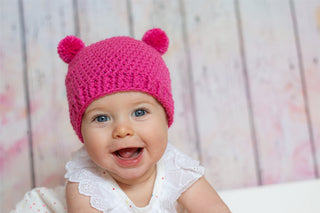 Dark pink mini pom pom hat