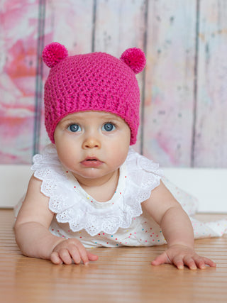 Dark pink mini pom pom hat by Two Seaside Babes