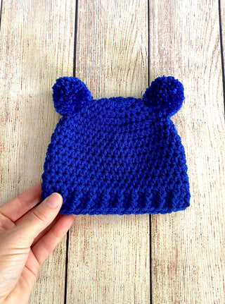 Royal blue mini pom pom hat by Two Seaside Babes