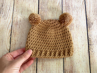 Light brown mini pom pom hat