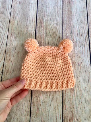 Peach mini pom pom hat by Two Seaside Babes