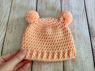 Peach mini pom pom hat