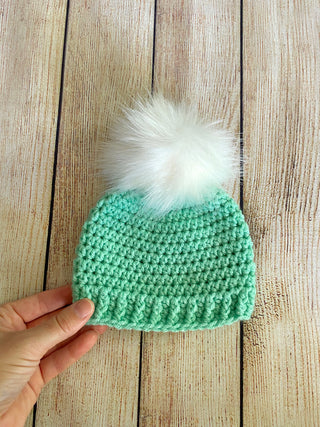 Mint green faux fur pom pom hat by Two Seaside Babes