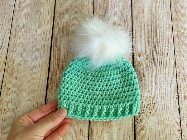 Mint green faux fur pom pom hat