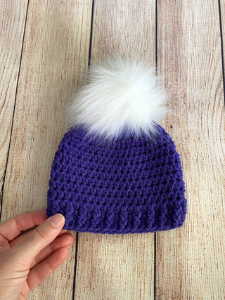 Purple faux fur pom pom hat by Two Seaside Babes