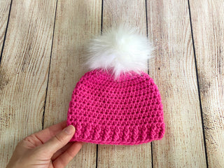 Dark pink faux fur pom pom hat