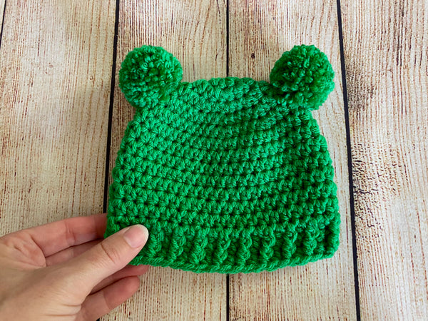 Green mini pom pom hat