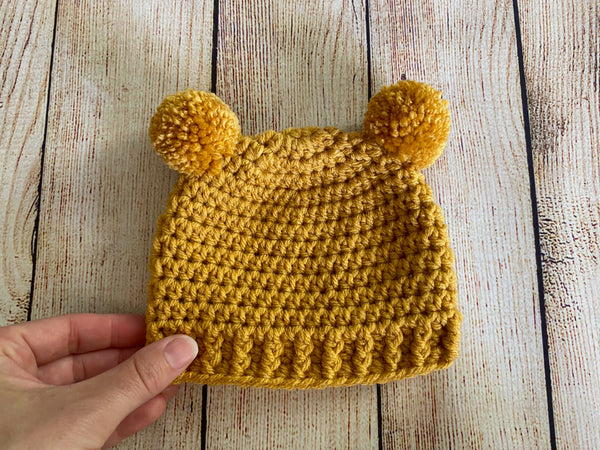 Golden yellow mini pom pom hat