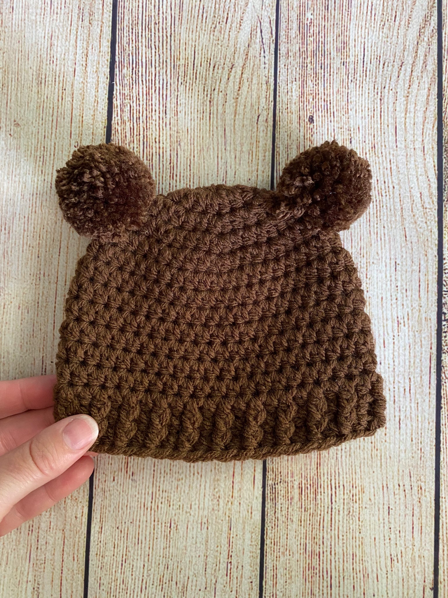 Brown mini pom pom hat by Two Seaside Babes