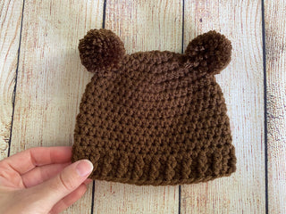 Brown mini pom pom hat