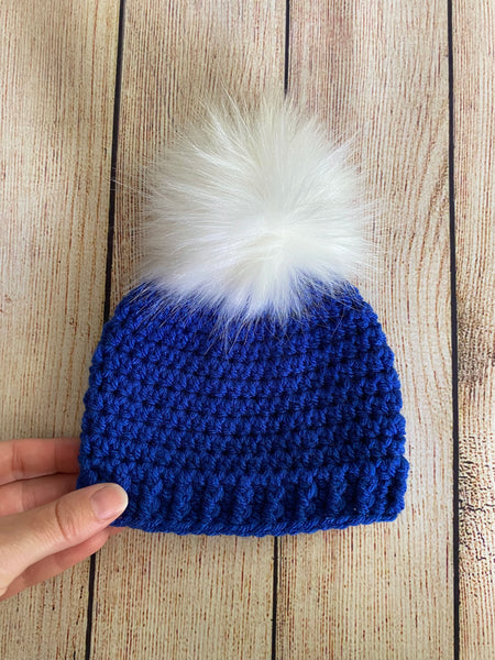 Royal blue faux fur pom pom hat by Two Seaside Babes