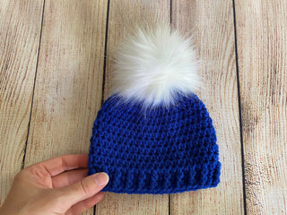 Royal blue faux fur pom pom hat