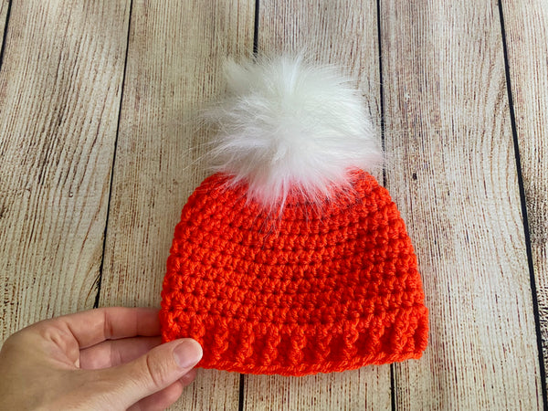 Orange faux fur pom pom hat