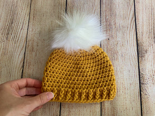 Golden yellow faux fur pom pom hat