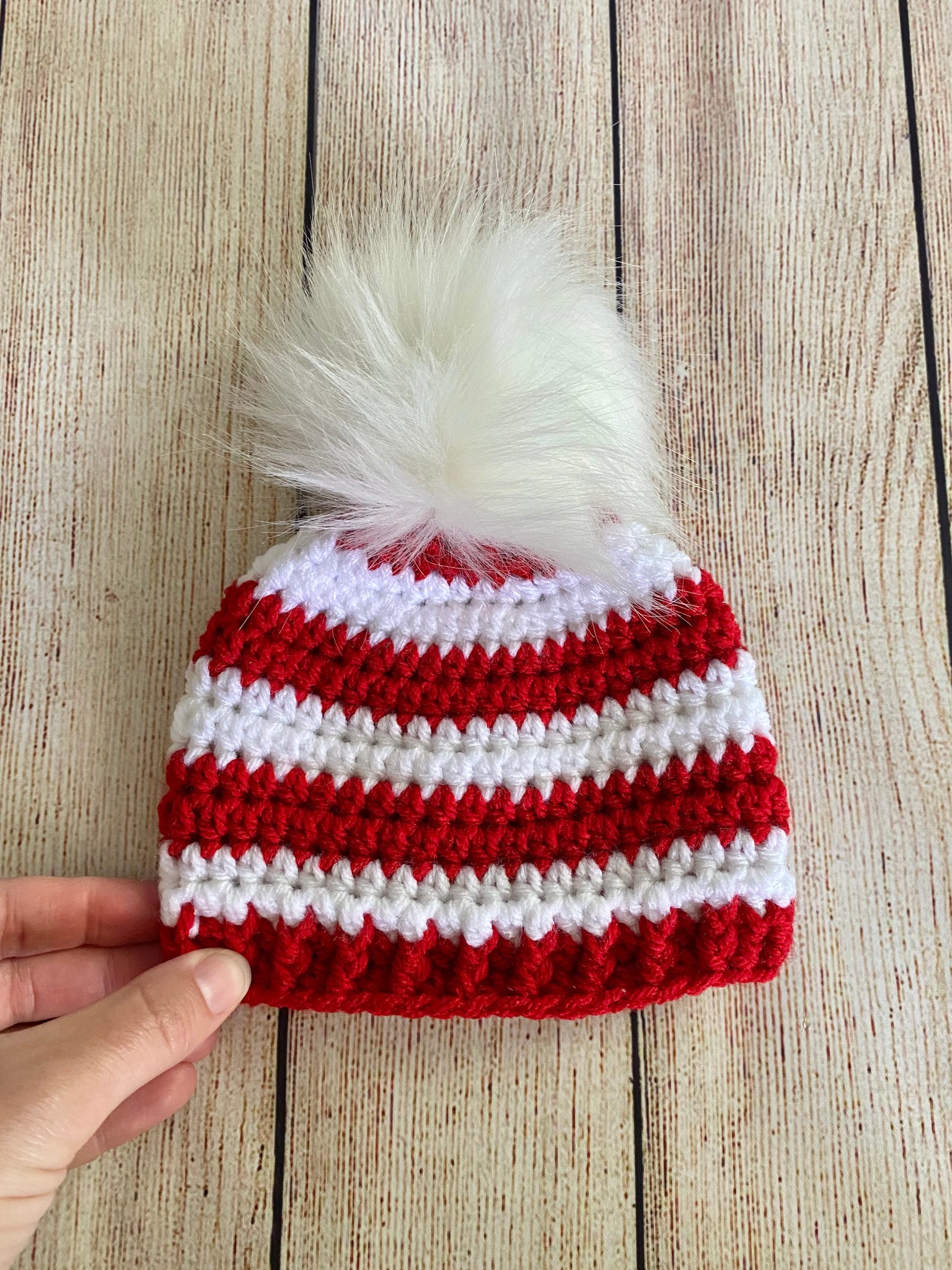 Red and white faux fur pom pom striped Christmas hat by Two Seaside Babes